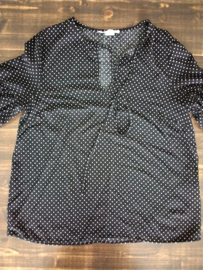 Haut noir à pois blancs
