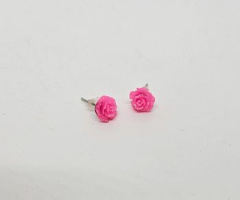 Paire de boucles d'oreilles.
Neuve.
Rose pailletée