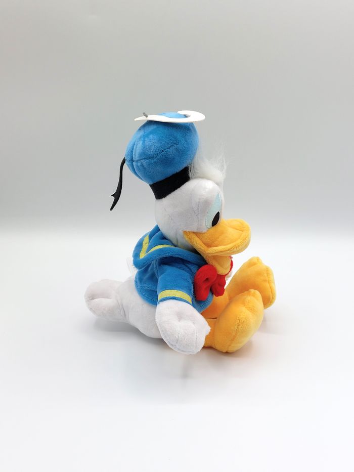 Peluche doudou Donald Duck DISNEYLAND Disneystore noeud rouge 30 cm comme neuf - photo numéro 4
