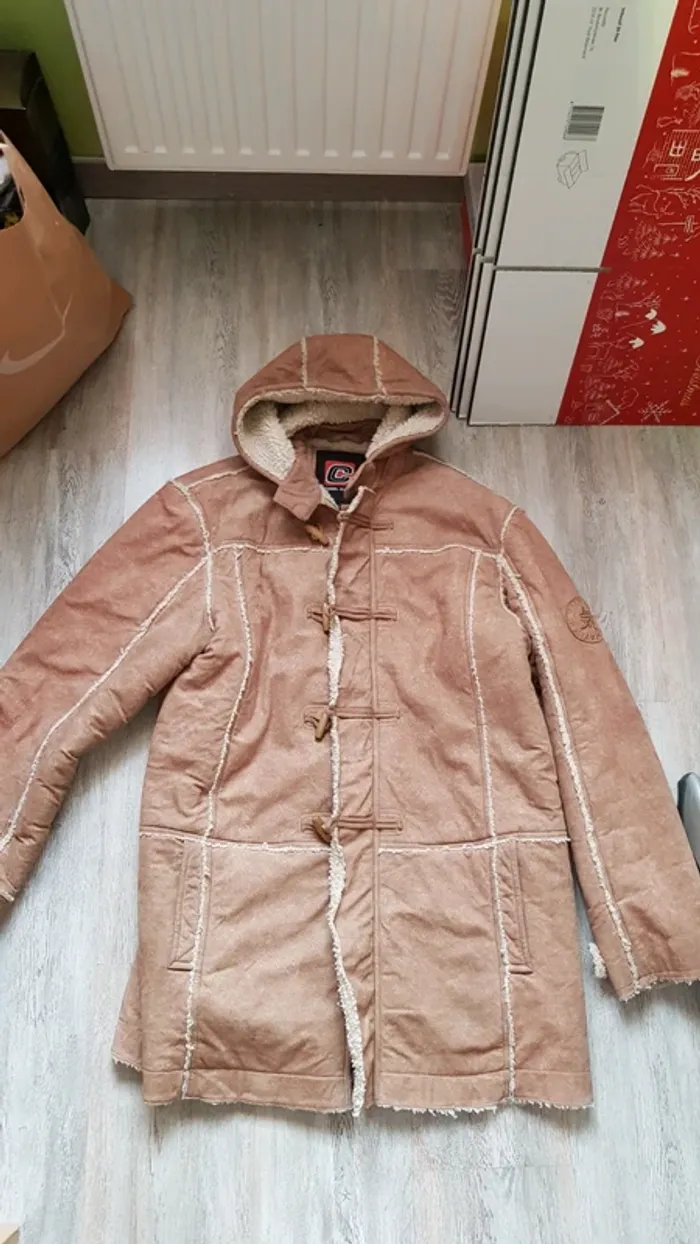 Manteau chaud type mouton retourné