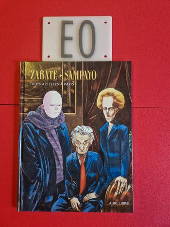 Bd trois artistes à Paris, EO