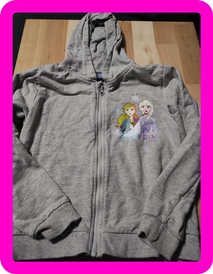 Gilet à capuche reine des neiges taille 7/8 ans en très bon état