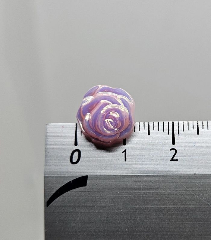 Paire de boucles d'oreilles.
Neuve.
Fleur rose claire - photo numéro 4