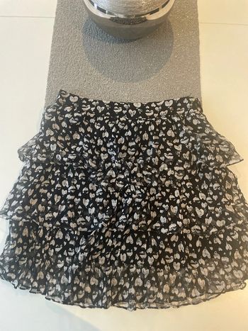 Jupe courte à volants