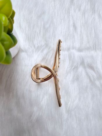 Pince à cheveux en métal doré