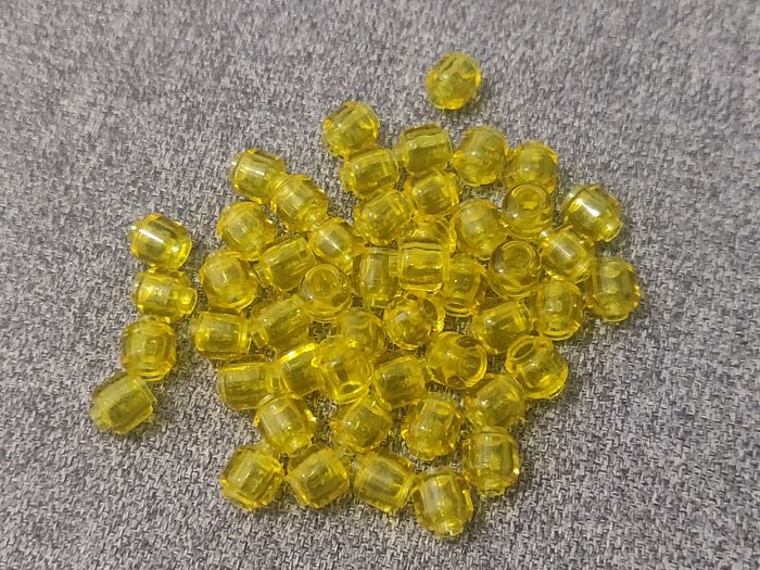 50 pièces têtes jaunes transparentes Lego - jamais utilisées parfait état - vrai Lego