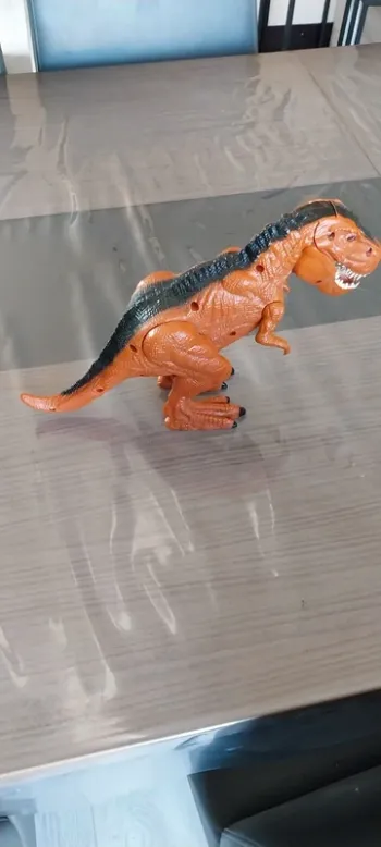 Dinosaure à piles très bon état
