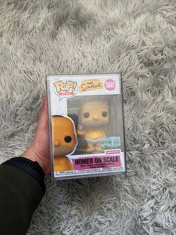 Funko Pop! Plus Homer on Scale with Pop! Protector