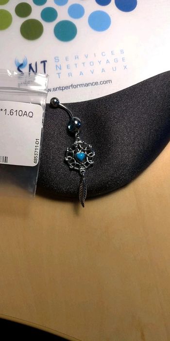 Piercing nombril attrape rêves