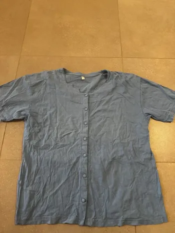 Haut bleu clair taille 52/54, très bon état