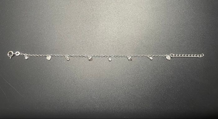 Bracelet en argent et breloques - photo numéro 2