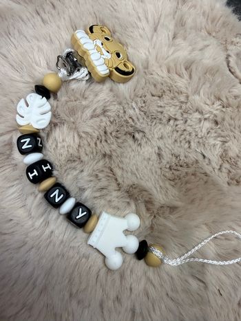 Attache tétine lion 