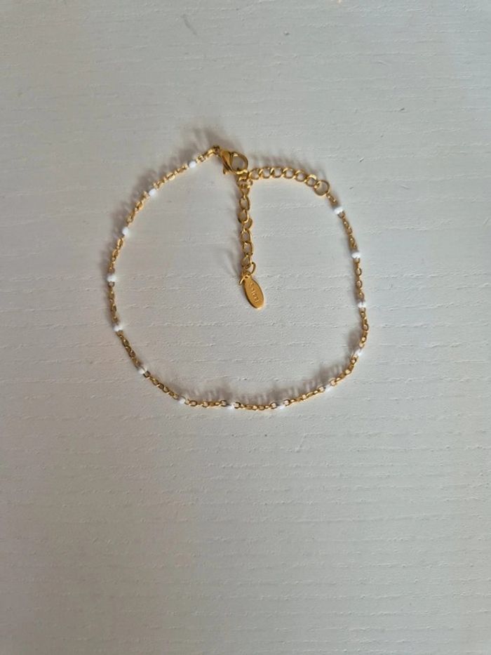 lot de 2 bracelets dorée or avec perles : 1 blanc, 1 rouge en acier inoxydable NEUF - photo numéro 2