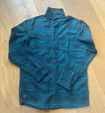 Chemise à carreaux en très bon état