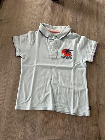Polo bleu palmier