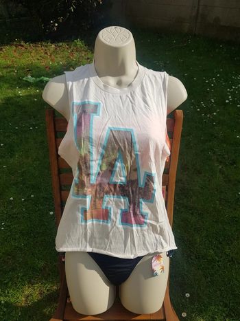 Tee-shirt sans manches taille XS Neuf