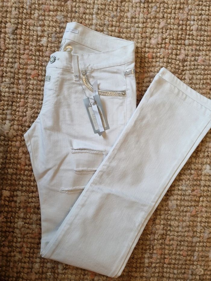Pantalon jean blanc déchiré T44