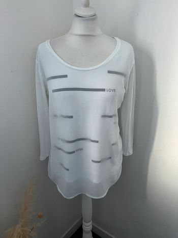 Blouse blanche à motifs icode S comme neuve