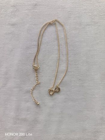 Collier doré symbole " infini"