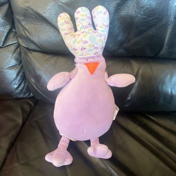 DOUDOU MUSICAL OISEAU MAUVE À CRÉTES OBAIBI 28CM