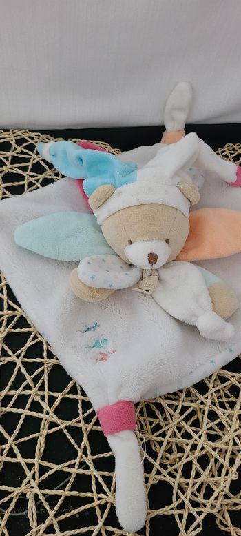 Doudou et Compagnie ours blanc bleu orange étoiles UNICEF