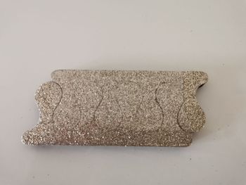 Séparateur d'orteils doré