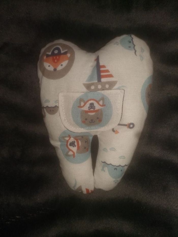 Dent en tissu pour passage de la petite souris