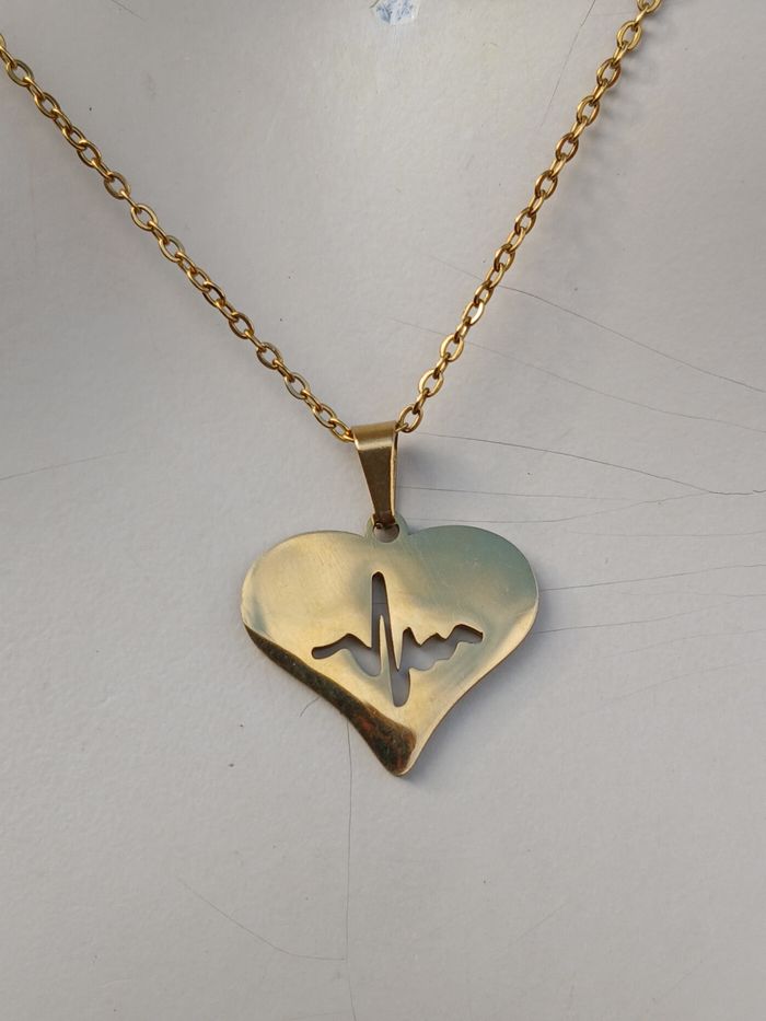 Collier en acier inoxydable doré coeur onde