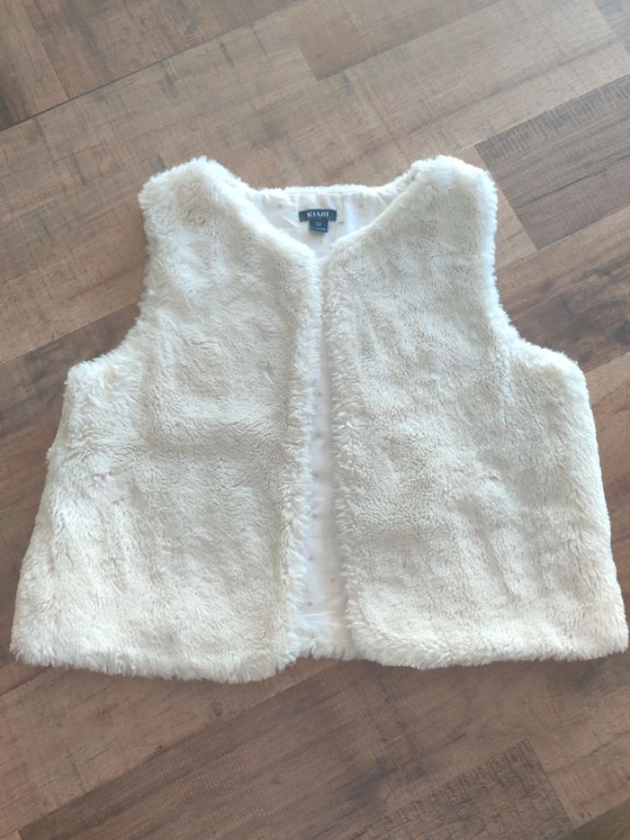 Gilet sans manche moumoute taille 5 ans taille comme un 5/6 ans