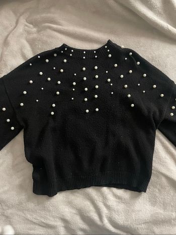 Pull noir à bille blanche