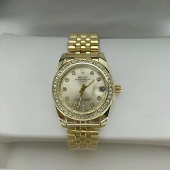Rlx datejust doré avec des pierres
