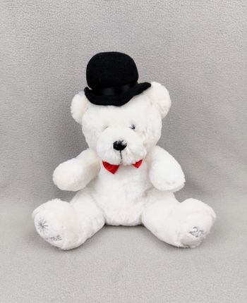 Peluche doudou ours blanc NOCIBE 2012 chapeau noir nœud rouge 28 cm assis étoile