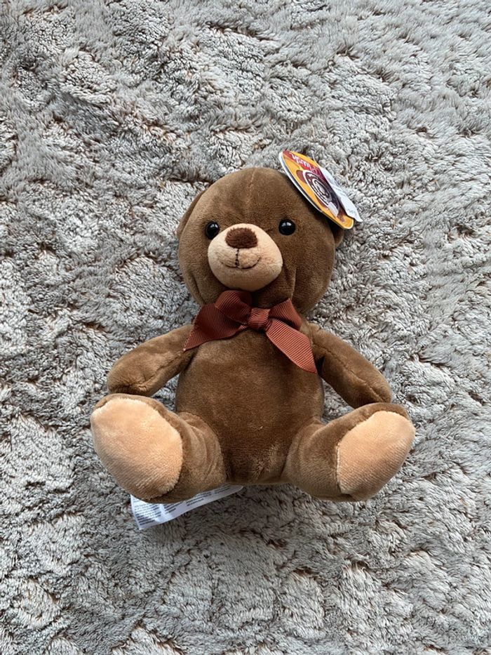 Jolie peluche ourson King Jouet