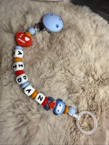 Attache tétine  robot