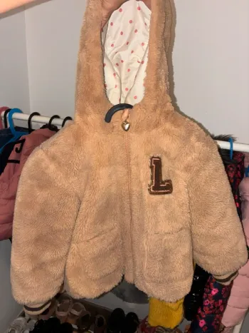 Manteau fausse fourrure