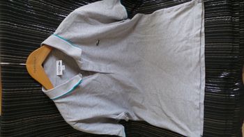 Polo mixe gris taille L Lacoste