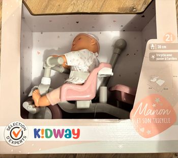 Poupon avec tricycle