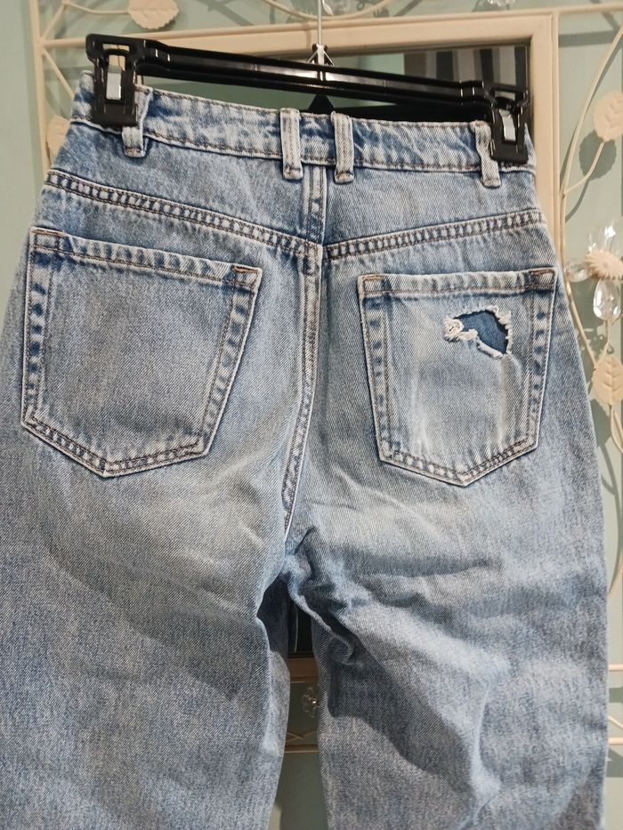 Jeans troué - photo numéro 6