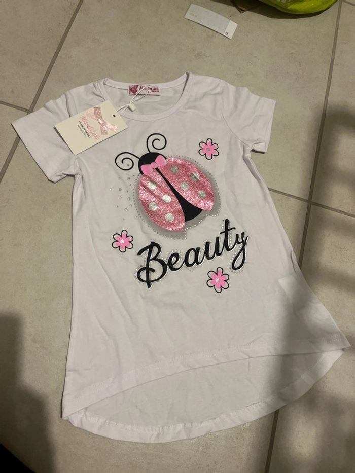 6 ans tee shirt blanc et brillant ! Coccinelle