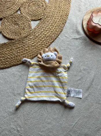 Doudou plat lion – Blanc & jaune rayé – Très bon état