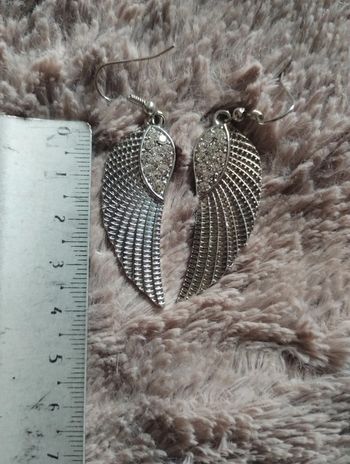 Boucle d'oreille ailes argentées