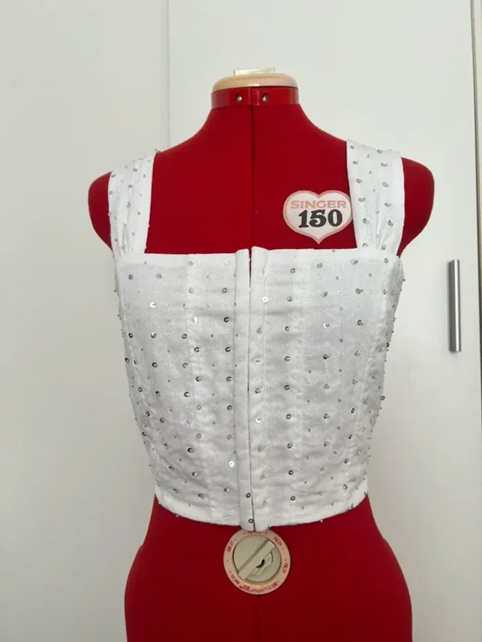 Top corset blanc et perles argentées Pimkie