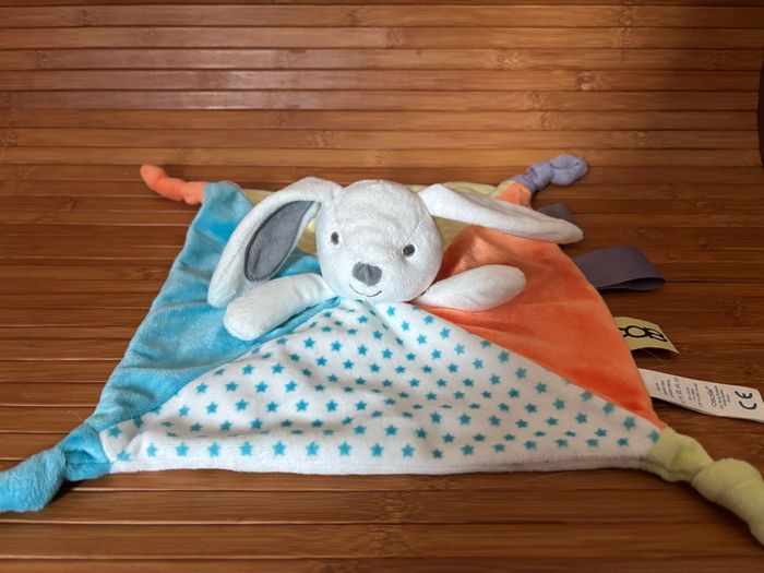 Doudou plat lapin bleu orange étoile obaibi