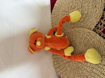 Doudou ours orange jaune bras jambes coulissant CMP