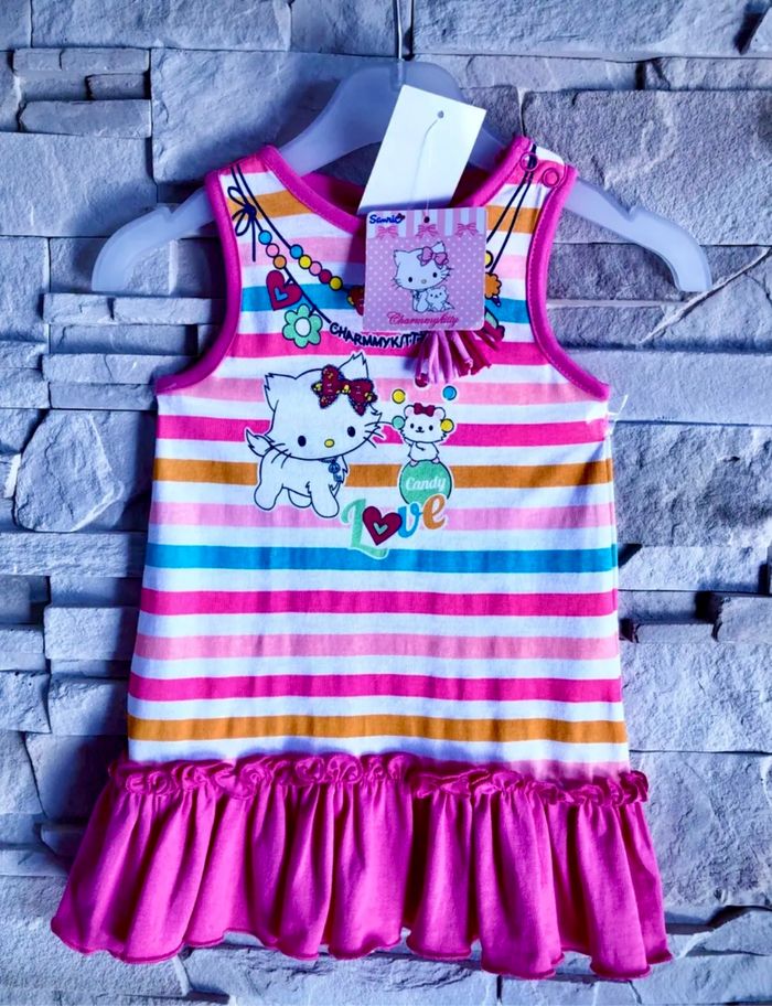 SANRIO - NEW - ROBE BÉBÉ FILLE MOTIF HELLO KITTY À VOLANT, TONS FLASHIES ET DÉTAIL PAILLETTES 6M - photo numéro 2