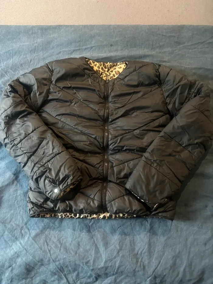 Veste torrente irréversible noir et léopard en très bon état