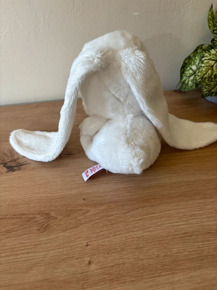 Doudou peluche lapin blanc grandes oreilles médaillon rouge trudi - photo numéro 3