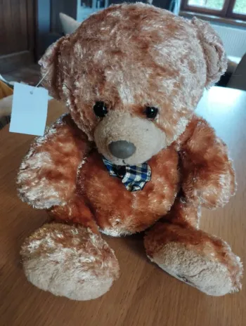 Superbe ours en peluche avec son petit noeud vintage