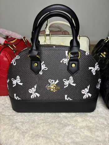 Sac à main Coach noir imprimé nœuds – Élégance chic & féminine