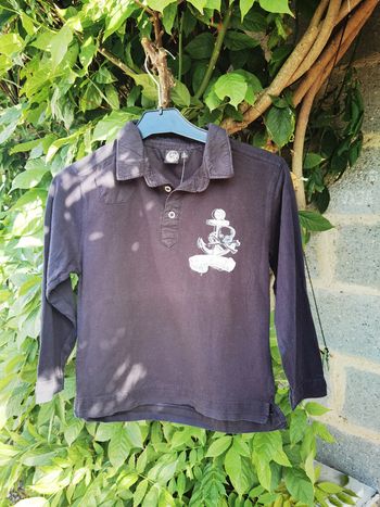 D829-polo noir 10 ans